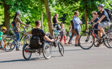 Cyclists riding through park